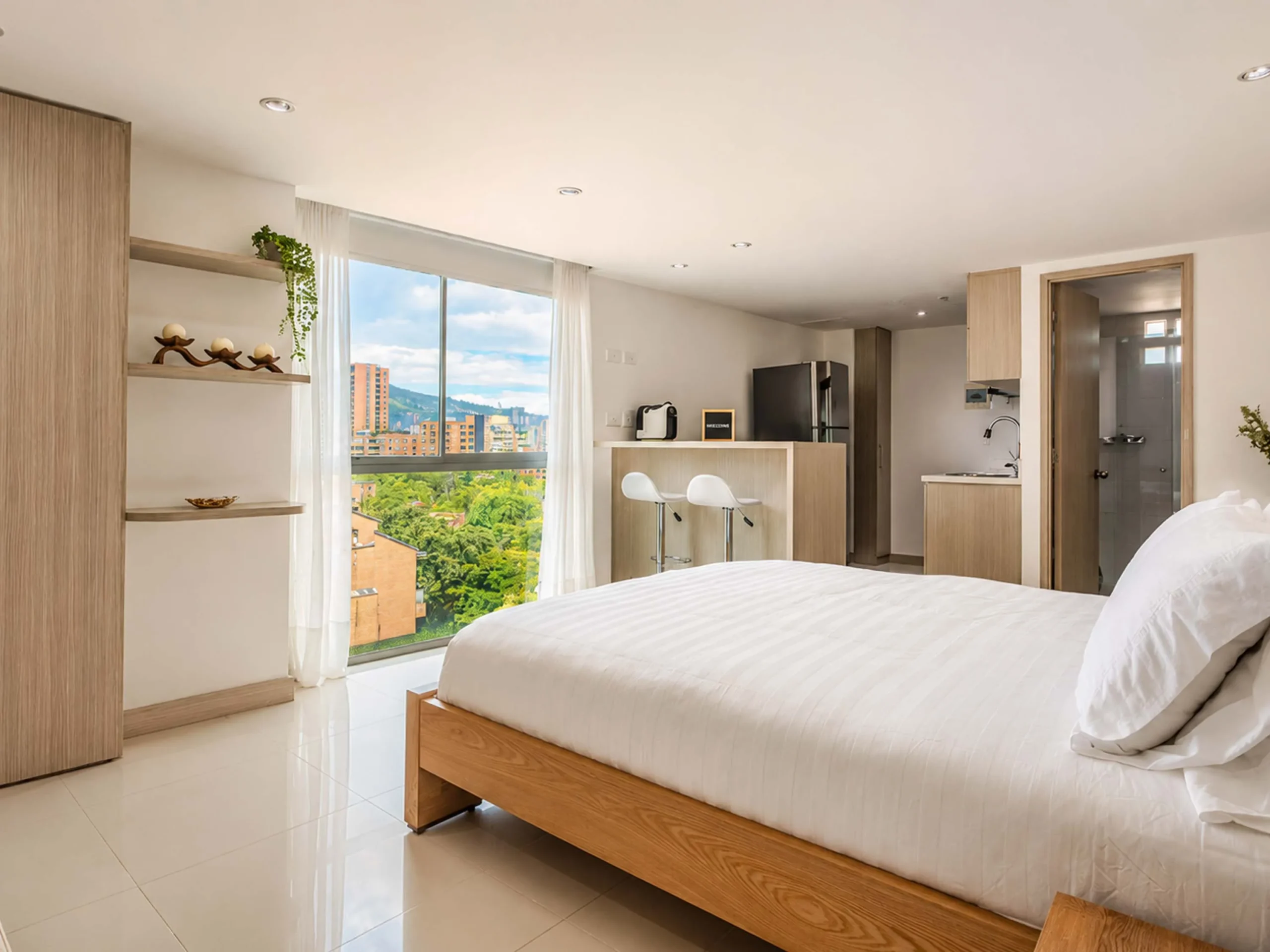 Fotografía retocada de apartamento usado con dormitorio y cocina en Bogotá